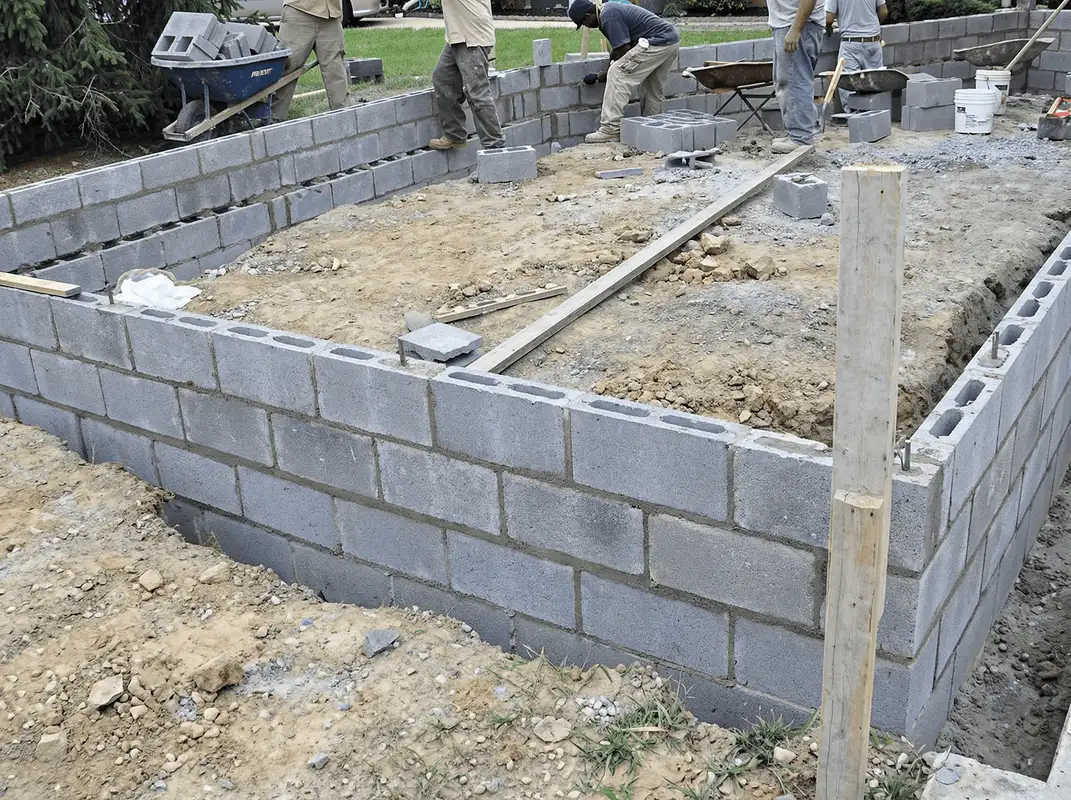 Professionals building a foundation with blocks in Tuscaloosa, AL