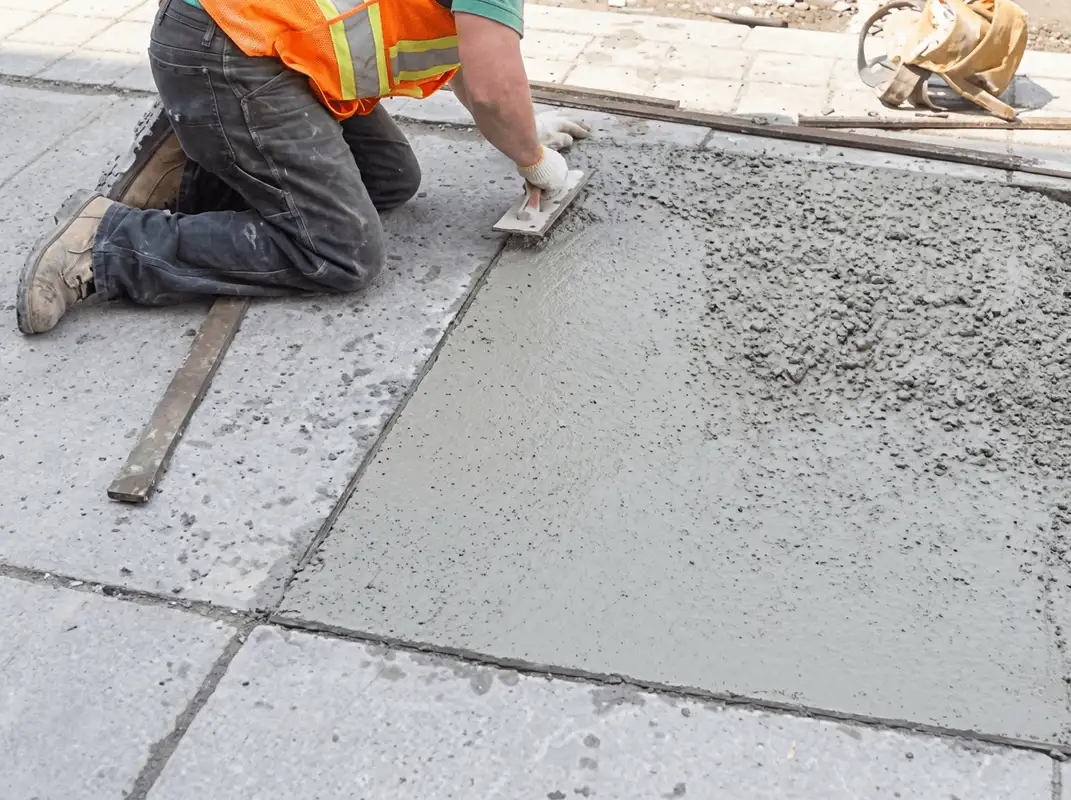 Professional repairing a concrete floor in Tuscaloosa, AL