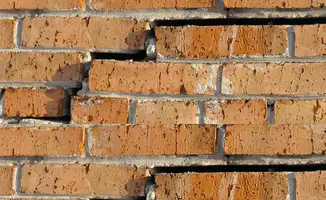 Brick wall with serious structural damage in Tuscaloosa, AL
